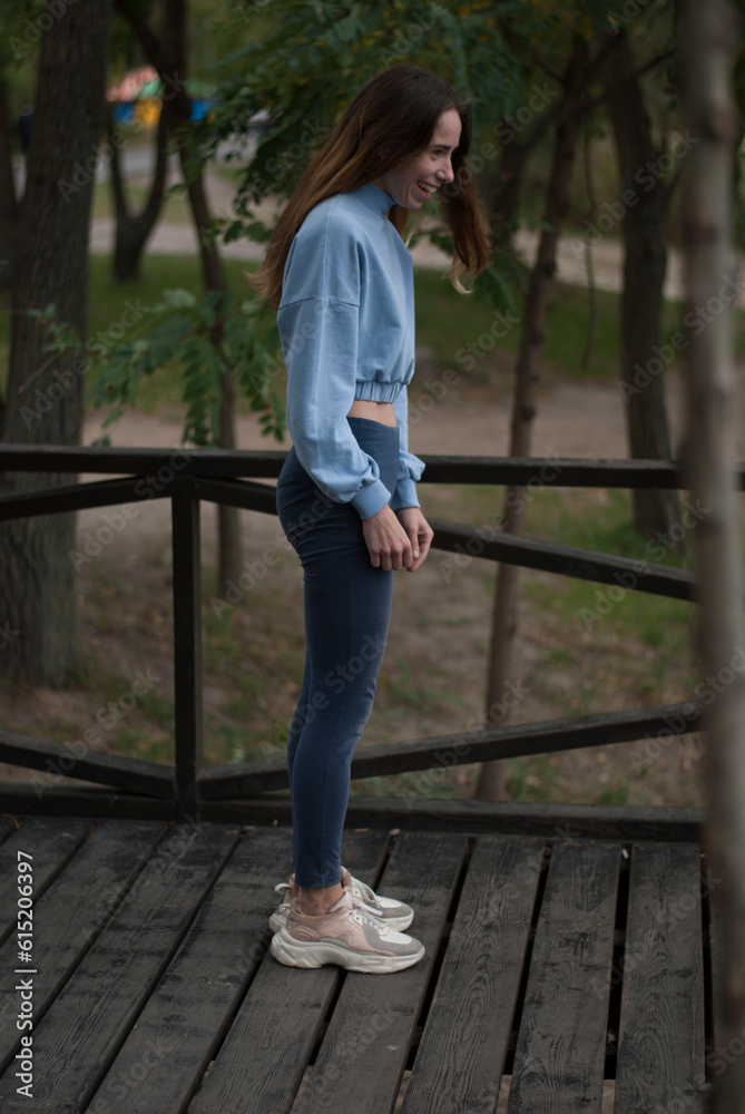 View of a girl with athletic body in rainy weather