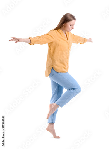 Young woman balancing on wh...