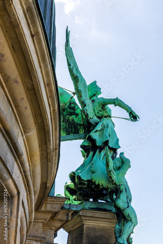 Angel figure on the roof of Berlin Cathedral (Berliner Dom) in Berlin, Germany photo