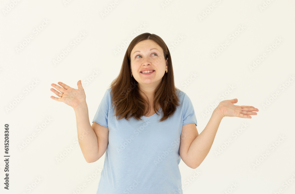 Sorry dont know, cant say. Cheerful cute pregnant girl, wear blue t-shirt, shrugging with hands sideways make awkward smile, apologizing, white background Sorry dont know, cant say. Cheerful cute pregnant girl, wear blue t-shirt, shrugging with hands sideways make awkward smile, apologizing, white background