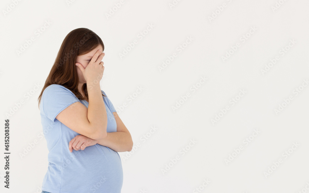Embarrassed annoyed adult pregnant woman hiding face bend head down, facepalm, smirk irritated, not looking friend acting weird, feel humiliated uncomfortable, standing white background Embarrassed annoyed adult pregnant woman hiding face bend head down, facepalm, smirk irritated, not looking friend acting weird, feel humiliated uncomfortable, standing white background
