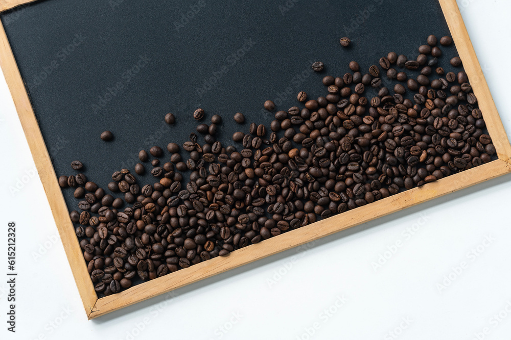 High quality coffee beans on black board with copy space for text High quality coffee beans on black board with copy space for text