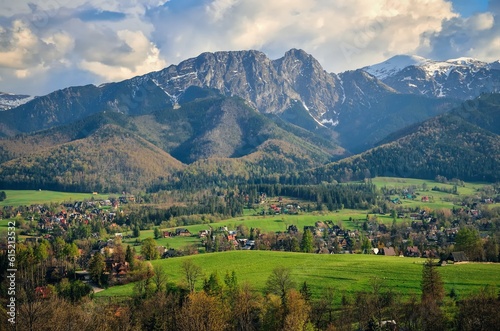 Obraz na płótnie Beautiful country view with mountains in the background. View of the Tatra Mountains and Koscielisko Village in Poland. w salonie