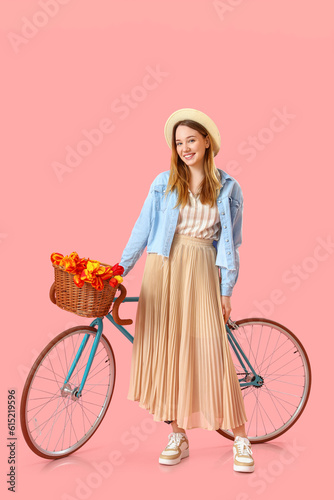 Young woman with bicycle on...
