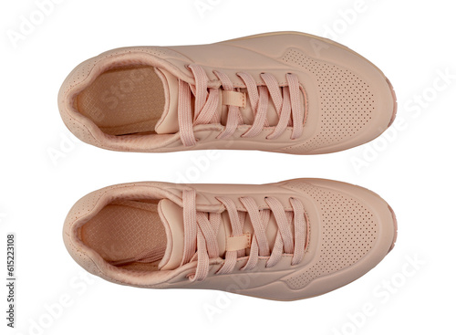 Pair of woman's sneakers isolated from background. Pink color. Top view