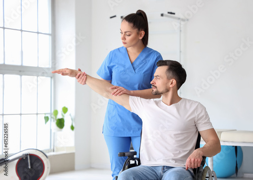 Female physiotherapist work...