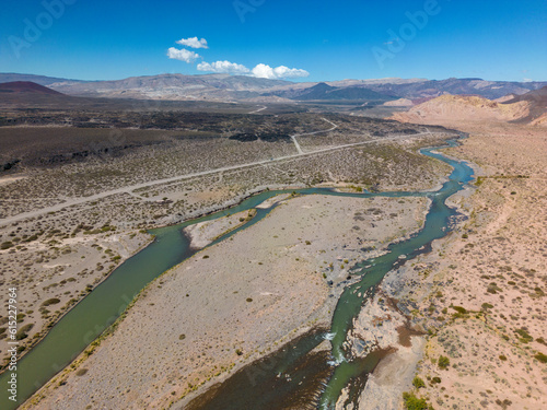 Fototapeta Naklejka Na Ścianę i Meble -  Aerial view of the remote and scenic nature with branches of the river Rio Grande along the famous Ruta40 in Mendoza Province in Argentina - Traveling South America 