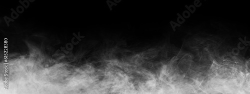 Abstract smoke texture over black. Fog in the darkness.