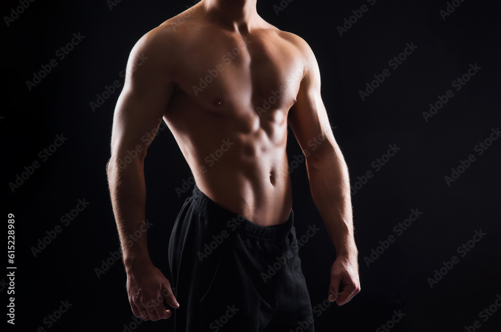 Strong, fit and sporty bodybuilder man over black background Strong, fit and sporty bodybuilder man over black background