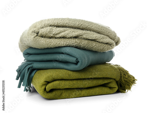 New soft folded blankets on white background photo