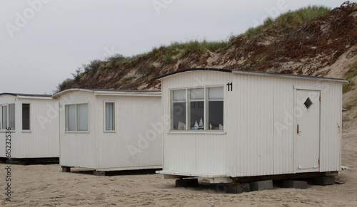 The beautiful beach cabins at Blokhus Beach in Denmark © mariannerjensen