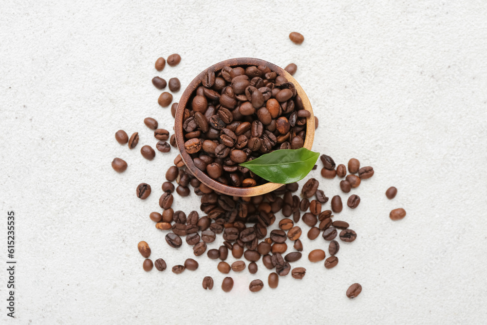 Bowl with coffee beans on light background Bowl with coffee beans on light background