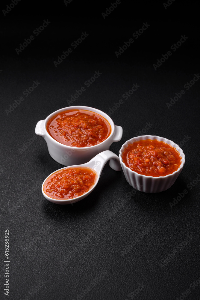Delicious spicy tomato sauce with pepper, garlic, salt, spices and herbs Delicious spicy tomato sauce with pepper, garlic, salt, spices and herbs