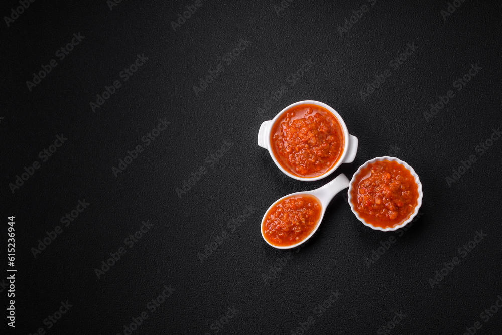 Delicious spicy tomato sauce with pepper, garlic, salt, spices and herbs Delicious spicy tomato sauce with pepper, garlic, salt, spices and herbs