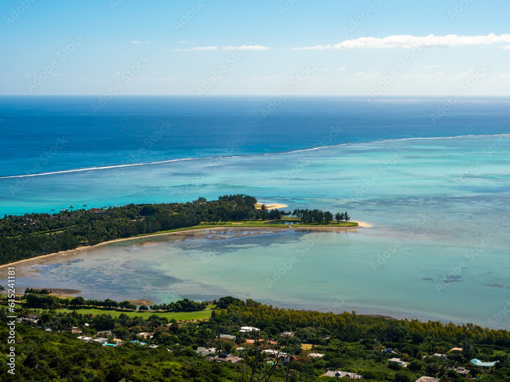 Paradise golf resort by tourquise ocean from high angle view in Le Morne beach, Mauritius