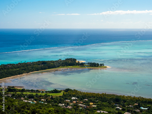 Paradise golf resort by tourquise ocean from high angle view in Le Morne beach, Mauritius photo
