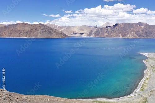 Experience the mesmerizing beauty of Pangong Tso lake in Ladakh, India, with its panoramic sapphire blue waters.  © Tenzin & Li