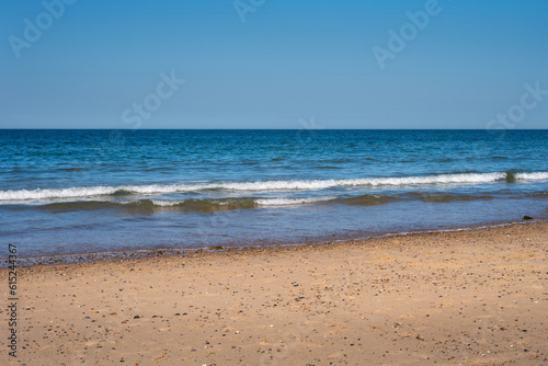 Photo of a sandy beach on a nice spring afternoon  use as a background