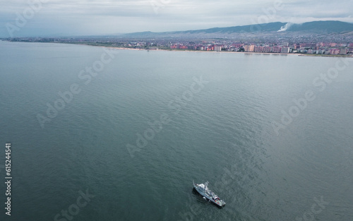 Ship in the Caspian sea and Makhachkala on the horizon photo