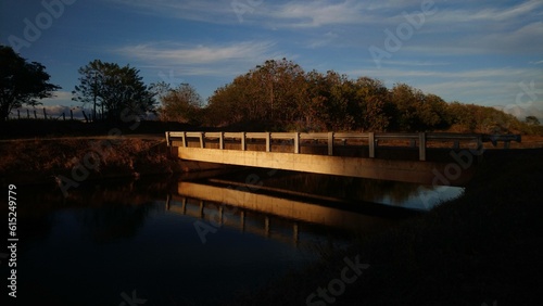 Lonely Bridge reflecting on the canal at dusk