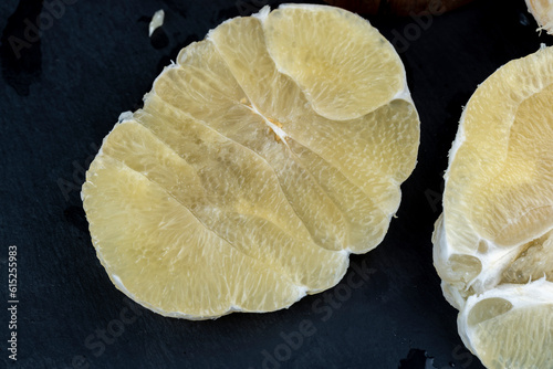cut into pieces of ripe juicy yellow pomelo