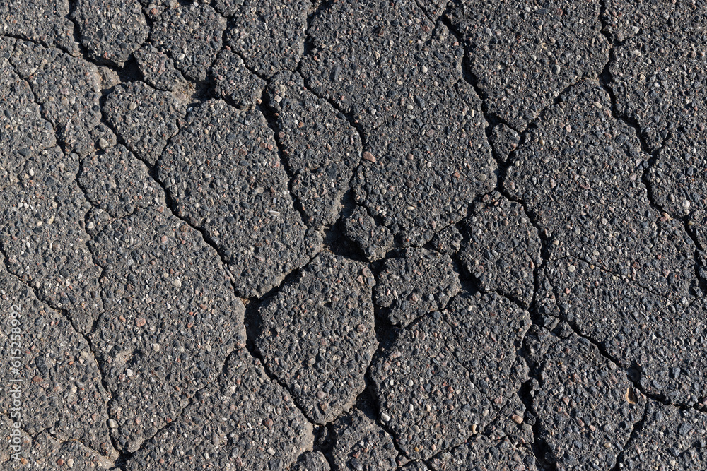 pits and cracks on the asphalt of the road pits and cracks on the asphalt of the road