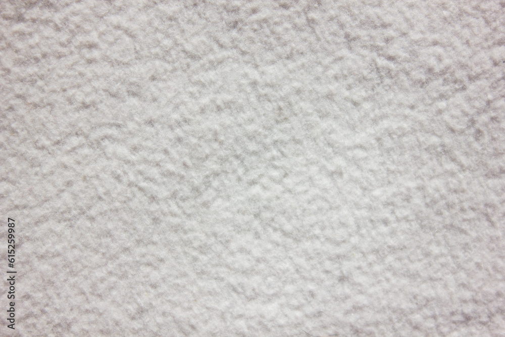 White delicate soft plush fleece fabric texture background. Background pattern of soft warm material White delicate soft plush fleece fabric texture background. Background pattern of soft warm material