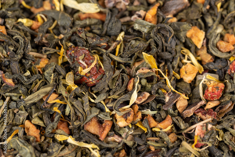 fresh green tea with pieces of fruit and berries