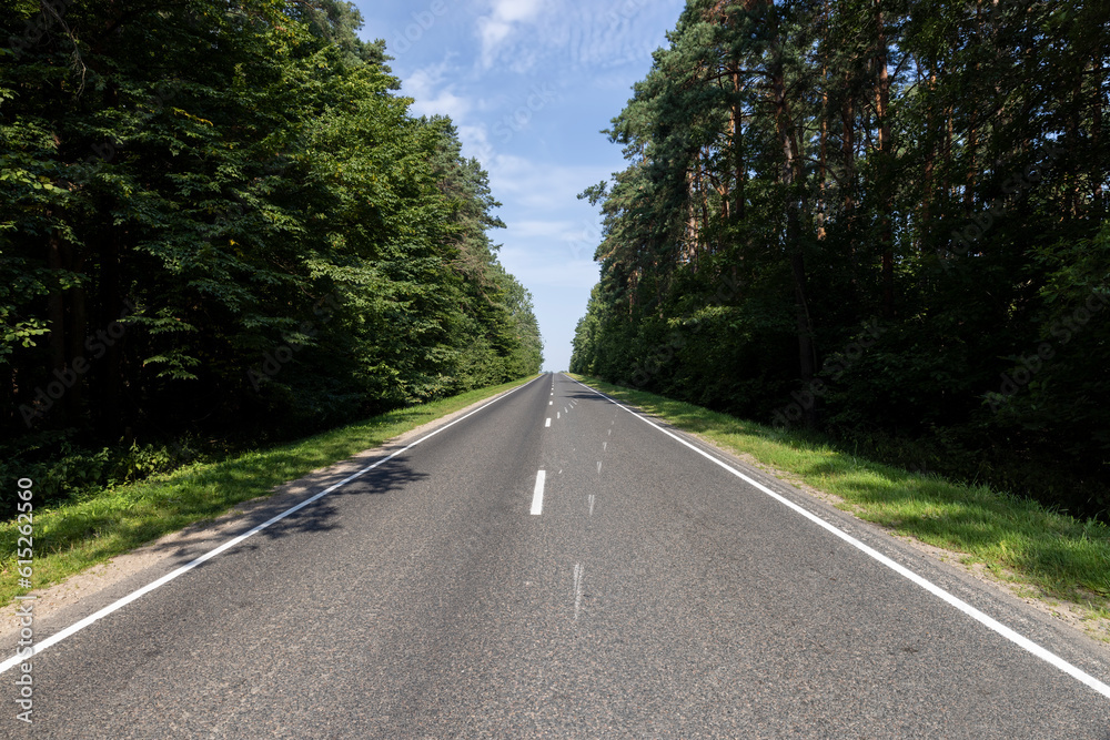 Obraz premium Narrow paved road for cars