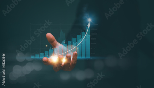 Business growth, progress or success idea concept, Businessman showing virtual graph hologram in hand, strategy planning, stock market, digital assets, corporate future growth plan.
