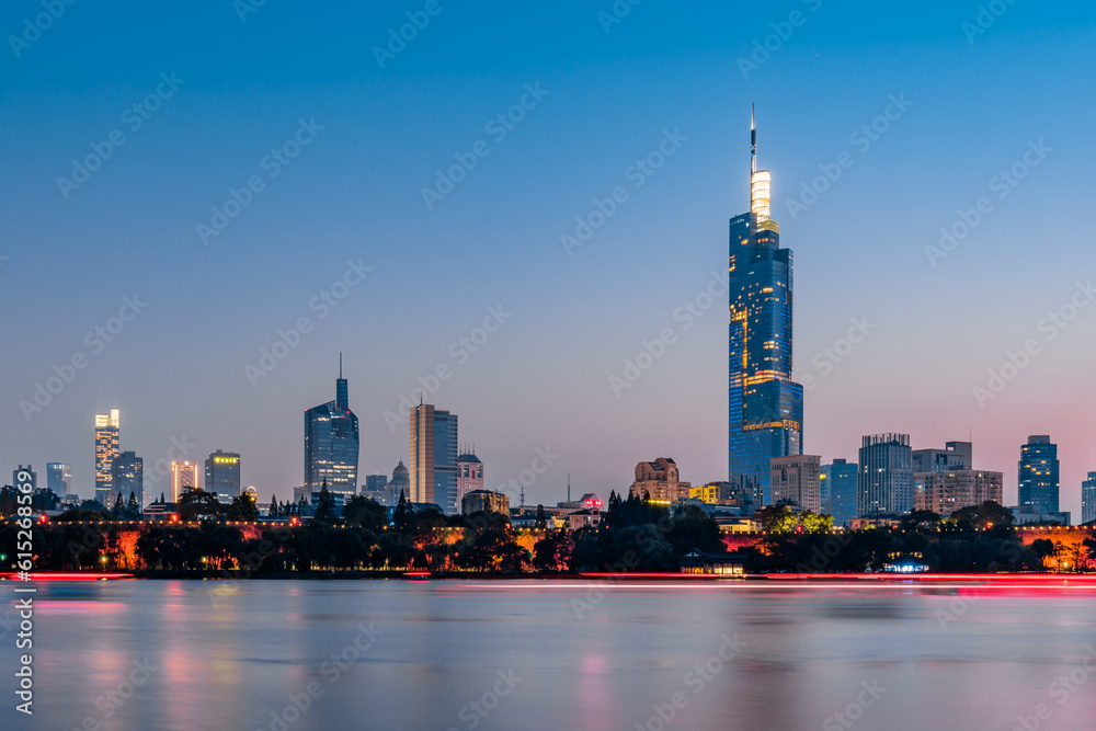 Fototapeta premium Early morning scenery of Xuanwu Lake and city skyline in Nanjing, China