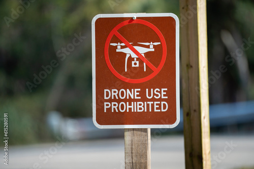 Signpost with warning about drone usage prohibition in state park. Warning notice against using UAV and quadcopters