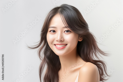 curly hair and an infectious smile, an Asian teenage girl showcases a positive vibe against a white backdrop. generative ai.