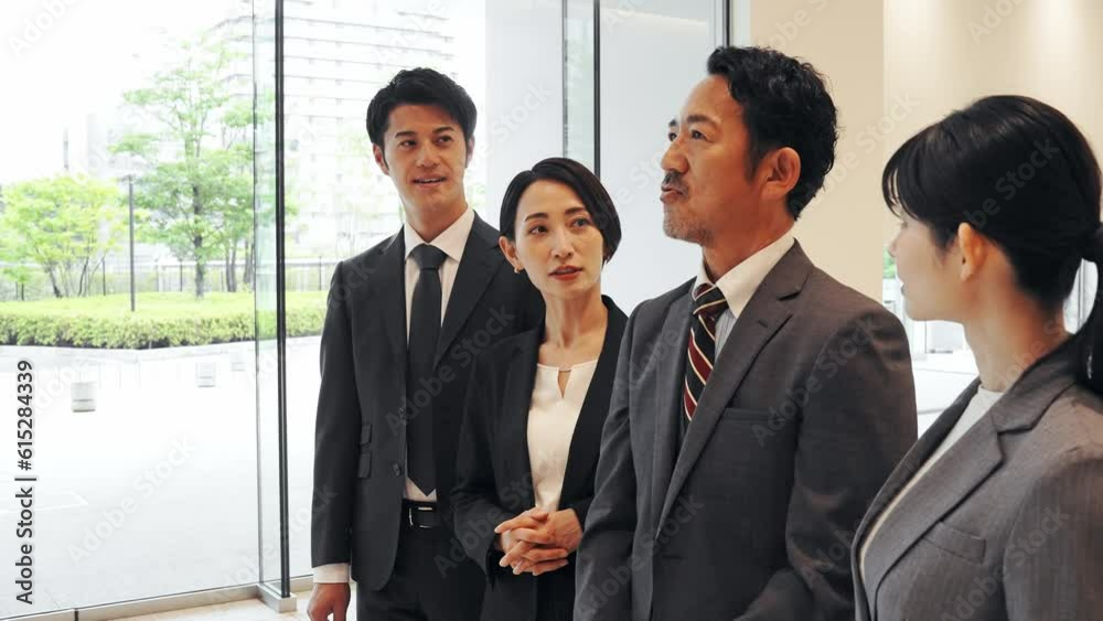 Group of various generation Asian businesspeople lining in lobby. Company employees who challenge for success. Group of various generation Asian businesspeople lining in lobby. Company employees who challenge for success.
