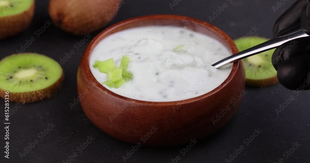 fresh yogurt made from natural ingredients with kiwi, milk fresh yogurt with kiwi flavor and kiwi slices fresh yogurt made from natural ingredients with kiwi, milk fresh yogurt with kiwi flavor and kiwi slices