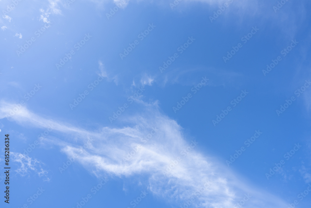 Blue sky and white cirrocumulus clouds texture background. Blue sky on sunny day. Summer sky. Cloud formation. Fluffy clouds. Nice weather in summer season. Weather pattern. Atmospheric phenomenon. Blue sky and white cirrocumulus clouds texture background. Blue sky on sunny day. Summer sky. Cloud formation. Fluffy clouds. Nice weather in summer season. Weather pattern. Atmospheric phenomenon.