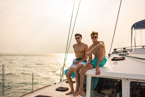 Caucasian men friend drinking champagne while having party in yacht. 