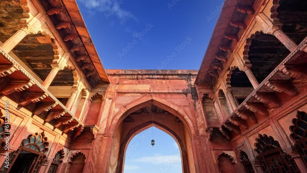 Agra fort gate time lapse on a blue sky day. Agra, India.