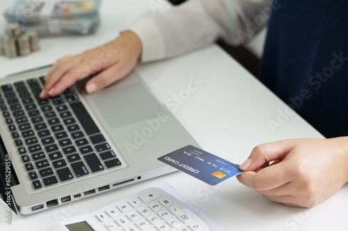 Woman hold credit card. Saving money concept.