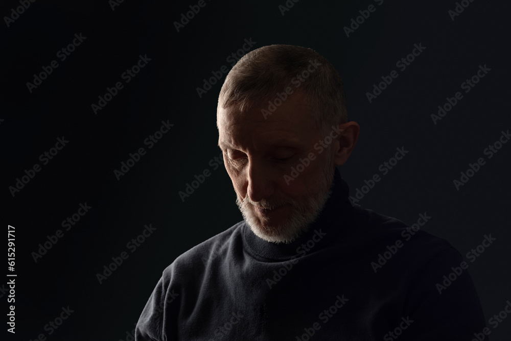 portrait of a sad adult man with a white beard on a black background, close-up, selective focus portrait of a sad adult man with a white beard on a black background, close-up, selective focus