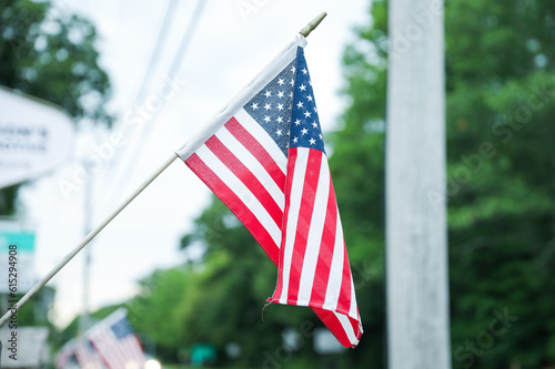 US flag waves proudly, representing the nation's history, unity, freedom, and patriotism. Its stars symbolize the states, while the stripes represent valor and resilience