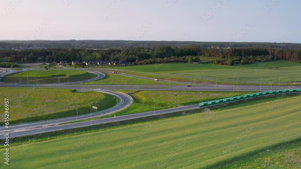 Aerial view of new build highway and roundabout surrounded by grass in Gdynia, Poland Aerial view of new build highway and roundabout surrounded by grass in Gdynia, Poland