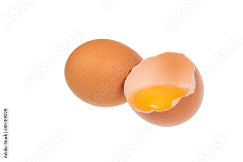 Yolk in an eggshell on a white background.