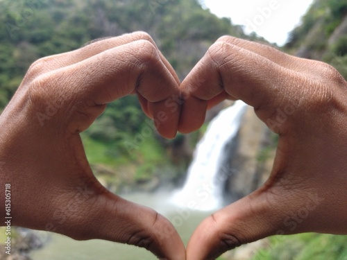The waterfall through a handed heart