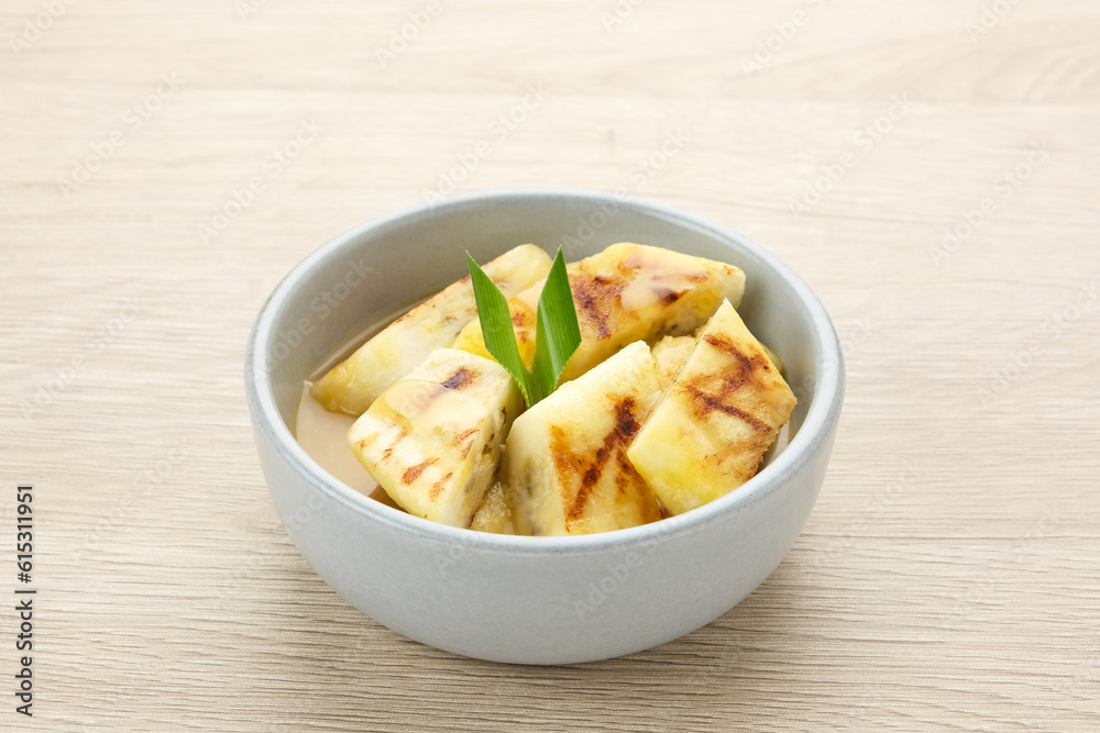 Pisang Gapit or Pisang Epe, grilled banana with palm sugar sauce. Indonesian traditional food.
Pisang Gapit or Pisang Epe, grilled banana with palm sugar sauce. Indonesian traditional food.