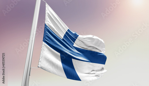 Finland national flag waving in sky.