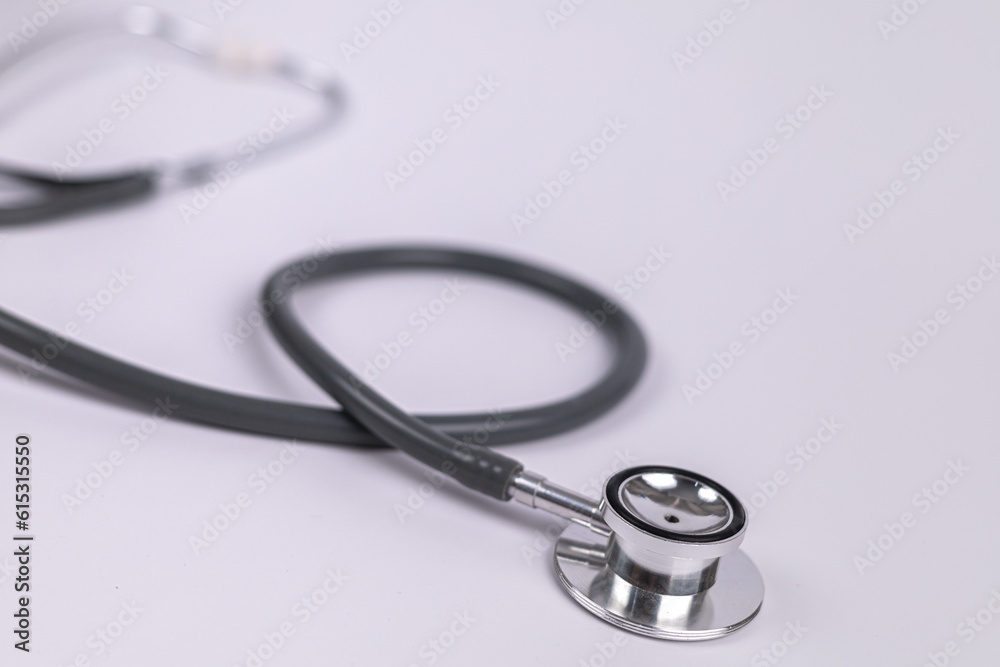 Gray doctor's stethoscope on white background, Medical concept. healthcare, medical Insurance concept. Gray doctor's stethoscope on white background, Medical concept. healthcare, medical Insurance concept.