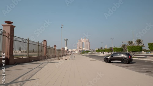sunny day abu dhabi city modern famous hotel traffic bay walking pov panorama 4k timelapse uae photo