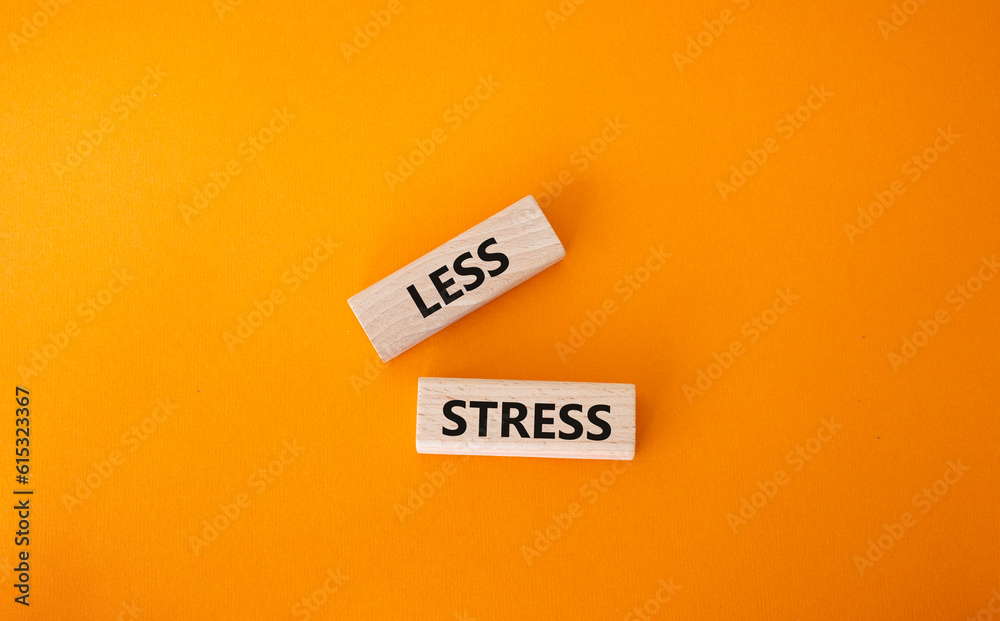 Less stress symbol. Wooden blocks with words Less stress. Beautiful orange background. Healthcare and Less stress concept. Copy space. Less stress symbol. Wooden blocks with words Less stress. Beautiful orange background. Healthcare and Less stress concept. Copy space.