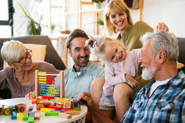 Cheerful multi-generation family having fun while spending time together at home.